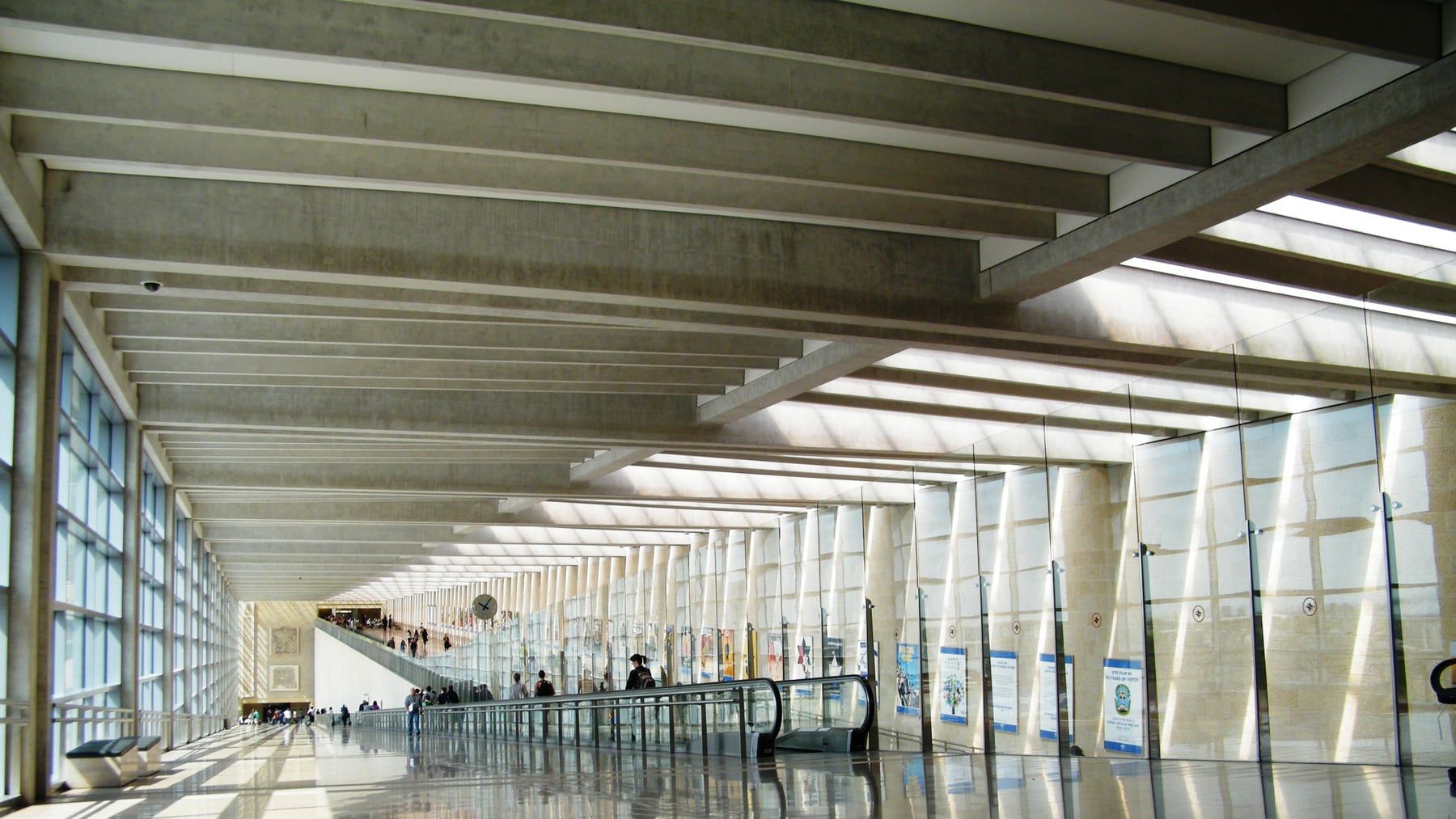 The arrivals walkway at Ben Gurion Airport, lit through its glass roof.
